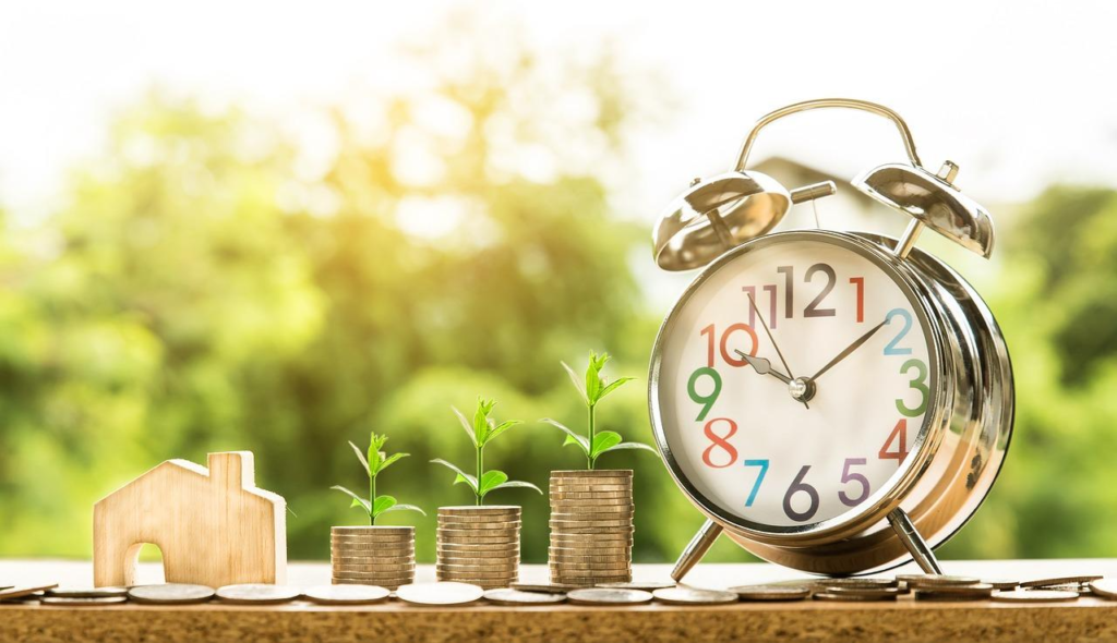 A House, Coins, and a Clock to Illustrate a Mortgage Loan