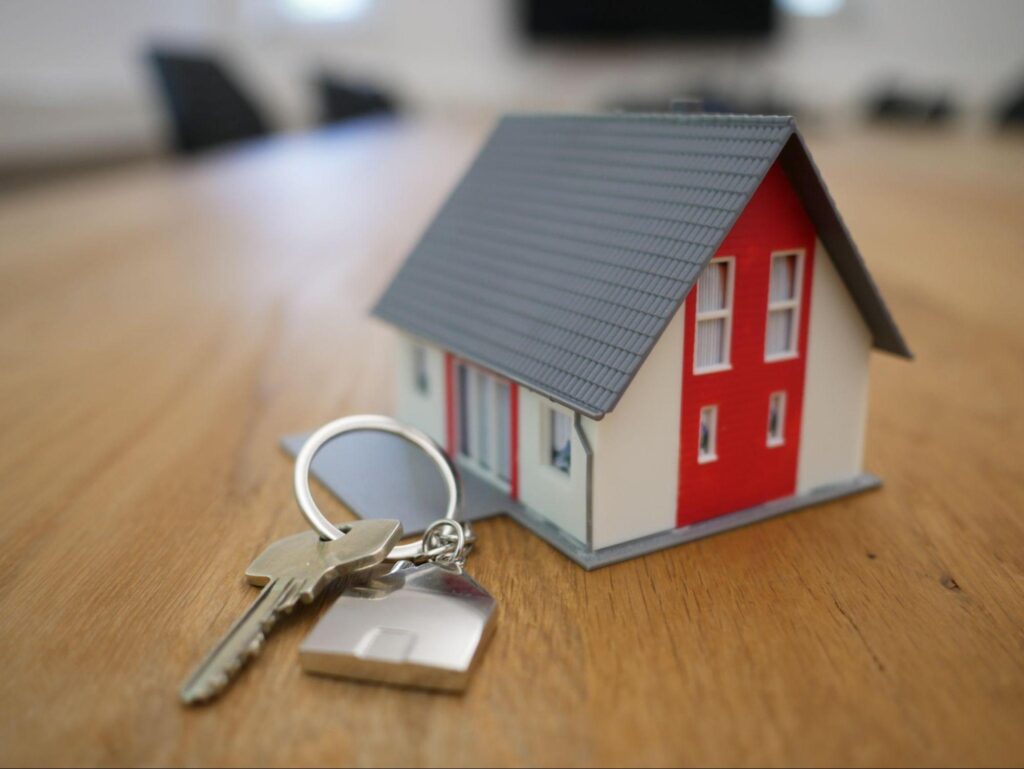 A set of house keys and a miniature