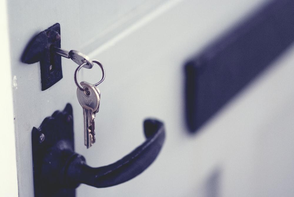 A set of keys in the lock of a front door